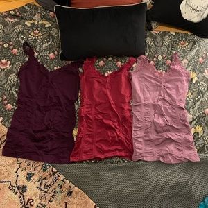 9 Kismet lace undershirts in multiple colors